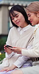 Business, phone and smile with women in city together for communication, search or streaming. App, scrolling and social media with happy Asian friends outdoor for agenda, digital calendar or schedule