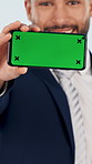 Face, businessman and mobile in studio with green screen, advertising and website for real estate. Portrait, realtor and phone with mockup space, presentation and property auction on white background