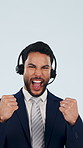 Telemarketer, face and man with headset, celebration and excited for telemarketing success in studio. Blue background, call center agent and happy person with mic, fist pump and lead generation win