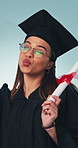 Selfie, graduation and woman in studio with scroll for university degree, certificate or diploma. Happy, pout and college student with photography picture for education achievement on blue background