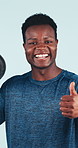 Thumbs up, weights and face of man for fitness, exercise and bodybuilder workout for strength. Happy, portrait and African person with emoji, approve and agree for strong muscles on studio background