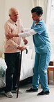 Cane, physiotherapist and bedroom of old man with support for walking, mobility or osteoporosis. Senior patient, aid or nurse for assisted living, balance or rehabilitation help in retirement home