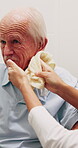 Assisted living, cloth and nurse cleaning old man in bathroom for elderly care or hygiene routine. Help, wash and senior person in retirement home with caregiver for aid, assistance or wellness