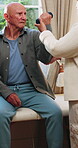 Physiotherapy, pain or senior man with dumbbell for health, shoulder rehabilitation or care. Retirement, elderly person or physiotherapist in office with weights, joint mobility or stress with injury
