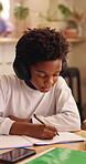 Writing, headphones and child with book for education, homework and practice mathematics in home. Study, notebook and kid with tech for lesson tips, development or productivity with audio assessment