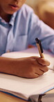 Writing, hands and child with notebook for homework, education and practice mathematics for learning. Study, book and kid with equations for lesson, development or productivity in academic assessment
