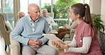 Clipboard, caregiver and old man in nursing home for questionnaire, feedback and check up. Retirement, writing and nurse with elderly person for assisted living, wellness report and talking for help