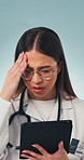 Doctor, woman and bad news in studio with tablet, medical research and stress for patient diagnosis. Healthcare worker, person and concern with tech, online test results and error on blue background.