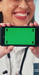 Hands, phone and doctor with green screen for medical news, telehealth app or advertising. Healthcare, smile and woman with cellphone, mockup space and online ui for clinic info, marketing or website