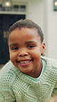 Face, smile and black girl in home for fun childhood, development or weekend vacation. Portrait, child or happy kid with pride, health or wellness for youth, growth or summer holiday break in house