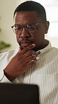 Laptop, thinking and black man in home with remote work for finance report or budget plan. Tech, freelancer and financial manager in house for investment advice, account feedback or portfolio tips