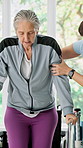 Senior, woman or physiotherapist with wheelchair for walking aid, rehabilitation or recovery. Elderly, practitioner or helping female person with a disability on handle rail for mobility assistance