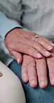 Home, closeup and senior couple for holding hands, comfort and trust for marriage and relationship. House, retirement and people with affection, understanding and bonding for connection, love or care