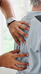 Back, hands and patient with physiotherapist for muscle rehabilitation or treatment in private practice. Person, practitioner or feeling spine with client for massage or tension relief in clinic