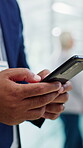 Texting, online and hands with phone in office, wealth manager and communication with contact on web. Business, financial advice and person with mobile, networking and updates on social media app