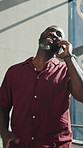 Laughing, business or black man with phone call for discussion or proposal in office building. Happy, businessman or smile with smartphone for friendly chat, funny humor or communication in workplace