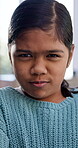 Angry, face and kid in house with tantrum, behavior challenge or frustration in emotional growth. Mad, unhappy or girl with conflict resolution, stubborn or discipline issue in child development.