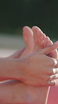 Hands, woman and stretching outdoor for fitness, getting ready and start exercise for wellness. Feet, person and muscle warm up in nature for pilates, flexibility and mobility training for self care