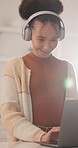 Headphones, laptop and happy woman in home for remote work, typing article or streaming music. Audio, freelancer and author with computer for ebook publication, story development or smile with review