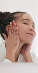 Skincare, mirror and woman in bathroom to check skin, hydration and wellness for beauty. Natural cosmetics, person and reflection in home for facial inspection, dermatology and touch for self care