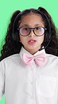 Consultant, child or face with headset on green screen for school career day on a studio background. Portrait, girl or kid agent talking with mic for junior consulting, virtual service or dress up