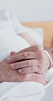 Nervous, hands and senior man in hospital with anxiety for surgery, treatment or operation. Unsure, healthcare and elderly person with uncertainty for medical diagnosis, bad news or checkup in clinic