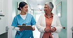 Hospital, walking and nurse with old woman with clipboard, medical report and consulting in clinic. Happy, corridor and healthcare worker with patient for advice, feedback and talking for checkup