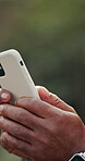 Typing, message and hands with phone, outdoor and communication with contact on social media or web. Texting, space and person with mobile app, scroll and networking with internet connection and chat