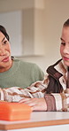 Talking, help and teacher with girl in classroom for assistance, learning and explain question. Teaching, woman and child with assignment answer for education, understanding and development at school