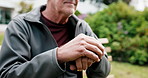 Thinking, hands and old man with cane outdoor for fresh air, mindfulness or reflection for health. Retirement, break and elderly person with walking stick for wellness, memory and nostalgia in garden