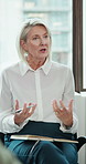 Therapy, talking and business people in workshop for mental health, wellbeing and counseling. Office, conversation and mature woman in support group for help, session or workplace wellness for advice
