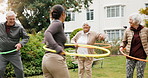Hoop, exercise and senior people outdoor for wellness, playful fitness and warm up for hip mobility. Retirement, garden and woman with elderly group for movement, balance and active for health