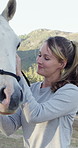 Happy, outdoor and woman with harness on horse for riding, adventure and equestrian hobby. Countryside, smile and person with saddle on animal on ranch for trail ride, lesson and practice in nature