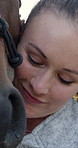 Smile, woman and petting in nature with horse, interaction and connection for horseback riding. Person, embrace or affection in countryside with equestrian, companion animal and nurturing for bonding