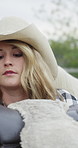 Prepare, cowgirl or horse on ranch with saddle placement, rider safety or routine for horseback ride. Equestrian, woman and getting ready with animal for equine hobby, protection gear and stability