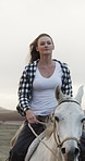 Riding, horse and cowgirl in nature with practice, equine hobby and training on farm in countryside. Happy, woman and equestrian on pet animal for adventure, freedom or jockey outdoor on ranch.