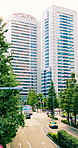 City, building or road with cars for outdoor location, destination or civilization in an urban town. People, street and vehicles with civilians for economic structure, travel or commute in Japan