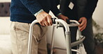 Caregiver, hands and senior person with walker in home for support, assistance or physical therapy. Man, old patient with a disability and frame in assisted living facility for physio and recovery