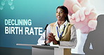 Presentation, podium and black woman with speech for declining birth rate or economic pressure. Female person, speaker or discussion in seminar with microphone for global population shortage or pitch