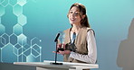 Woman, speech and thank you with award on podium for nomination or announcement in ceremony. Happy, female person or pitch with reward or trophy for business success, achievement or career milestone