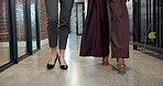 Collaboration, legs and walking with business women in office together for financial career. Feet, finance and steps with employee people in corridor of corporate workplace for accounting or teamwork