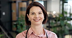 Face, doctor and happy woman in office for medical assistance, healthcare service or help. Portrait, female person or health professional with smile, pride or confidence for advice in workplace