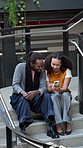 Phone, conversation and couple on stairs at university for email on scholarship update together. Technology, happy and man with woman on cellphone for feedback on college application on steps.