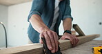 Carpenter, hands and sanding in workshop with wood, building furniture and restoration project tools. Man, sandpaper and DIY craft in factory for timber manufacturing, production and carpentry job.