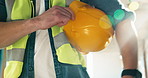 Construction, builder and hand with helmet for safety, regulatory compliance or building inspection. Architect, quality control and person with hardhat for protection, bokeh and property development
