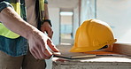 Hands, architect and notebook with helmet on construction site for building safety, PPE or security. Man, contractor or civil engineer with hard hat for architecture, inspection rules or regulations
