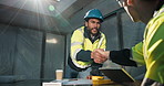 Handshake, construction and men with blueprint for agreement, planning and remodeling project. Architecture, meeting and people shaking hands for building, engineering and floorplan for renovation 