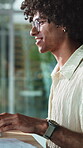 Creative, online and man with computer in business, copywriting and plan for article or publication. Copywriter, typing and happy person with tech, info and reading paperwork for story development