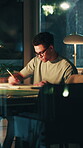 Architect, sketch and man with paperwork at night, overtime and drafting layout for design deadline. Architecture, drawing and mature person with document, working late or editing blueprint in office