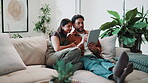 Couple, relax and talking in home with tablet, online banking and planning for finance priorities. Smile, people and discussion on sofa with tech, account balance and cost comparison for loan payment